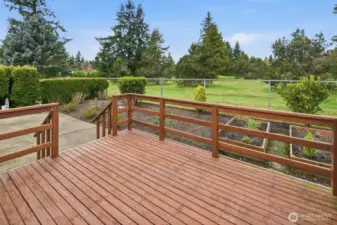Entertainment-size deck overlooking your planter beds and golf course