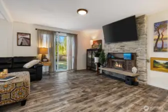 Large living room with wood stove.