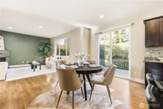 The living room flows directly open to the kitchen with enough room for dining and easy access to the backyard through the sliding door