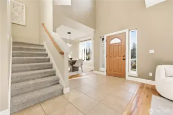 Heading upstairs leads to the remaining bedrooms and bathrooms, including the primary suite