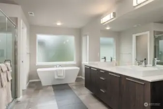 Amazing primary bathroom with shower and soaking tub