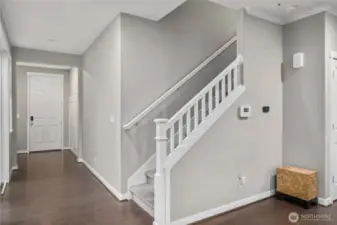 Stairs up to landing flex space, utility room and bedrooms