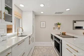 Sleek, designer styled kitchen with induction cooktop.