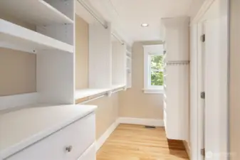 Primary walk in closet with California Closet built-ins