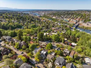 Bird's eye view looking NNW along the canal to Ballard, Hiram M Chittenden Locks and out to the Sound and Olympics