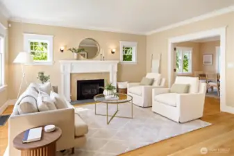 Living room looking through open French doors to dining room