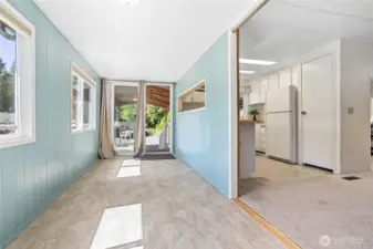 The sitting room extends to the carport entrance