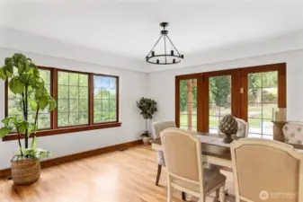 Large dining room with room to host friends and family while natural light pours through the windows