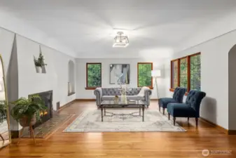 Open and bright living area with wood burning fireplace