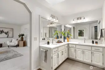 Sleek quartz counters and refreshed cabinets complete this gorgeous bathroom