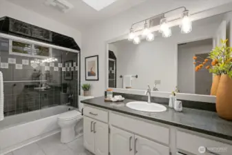 Brightened by a skylight and stylish timeless design revival.