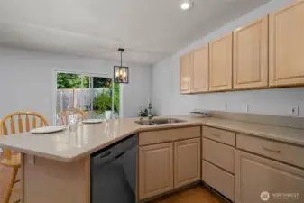 Sliding door leads to private backyard...