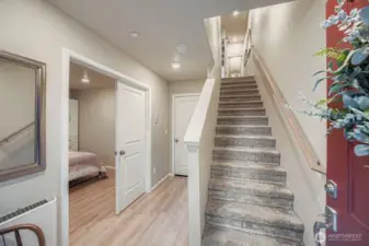 Upon entrance fine access to lower bonus/bedroom, garage and stairwell to upper levels.