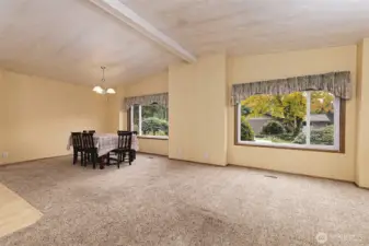 Big living room looking back to the dining area. The kitchen is around to the left.