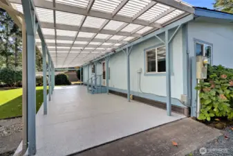 This has a really nice chip-sealed epoxy floor!  Easy on the feet, and easy to clean.