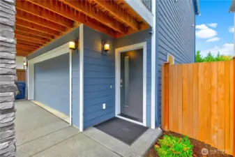 Spacious garage and grand front entrance.