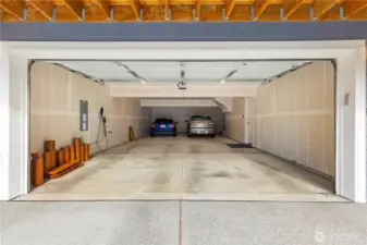 Even with two cars parked, the spacious garage can still accommodate up to four large vehicles.