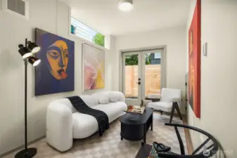 Bright and airy living space with tall ceilings and direct access to the private outdoor patio.