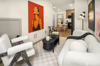 Open floor plan with minimalist design elements and large windows that invite the outdoors in.