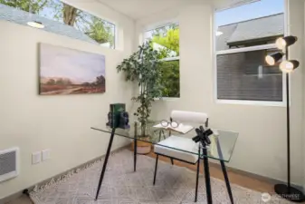 Dedicated office space filled with natural light, perfect for a quiet work-from-home environment.
