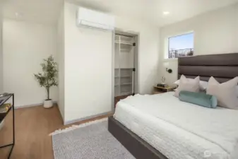 Alternative view of the primary suite showing the integrated ductless mini-split for personalized climate control.