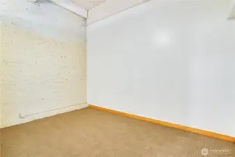 Spacious and serene, the bedroom comfortably accommodates a bed, nightstands, dressers, and more—room to truly relax and unwind.