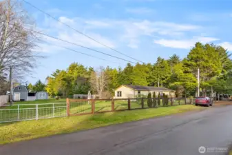 Fully fenced property, which shows the adjacent lot (& outbuildings) that are for sale separately.