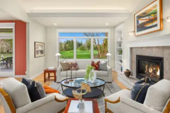 Living room with great natural light and views of the course and nature