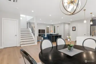 The elegance of the formal dining area. Situated just off the kitchen, it serves as the heart of the home - a versatile space where formal meals and everyday celebrations come to life. Whether you're hosting a grand dinner party or enjoying a quiet family meal, this area is designed to gather people together, creating memories that last a lifetime.