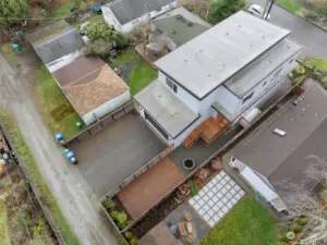 Aerial of the back of the home. Wonderful street with curbs and sidewalks and alley access. Only minutes to Amazon, downtown, the UW and 520.