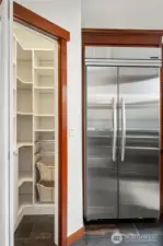 Built-in commercial grade KitchenAid refrigerator & walk-in pantry