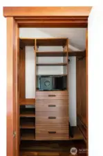 Primary bedroom closet #1 with safe and built-in shelves/drawers
