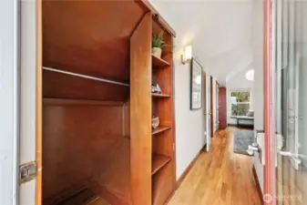 Primary bedroom closet #2 with custom swinging bookcase