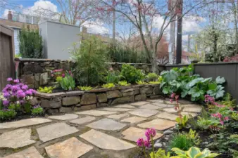 Stone patio and fully fenced garden space