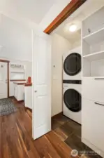 Entry hall with laundry closet and built-in shelving