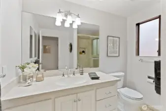 The ensuite primary bathroom has an oversized shower and plenty of room to get ready in the morning.