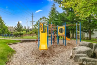 Neighborhood park just steps away with play structure, open green space, and walking paths—great for kids and outdoor fun.