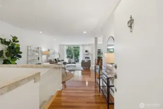 Main entry views to the open floorplan on  main and stairs down to the lower level