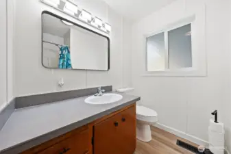 Hall bath with tile tub surround