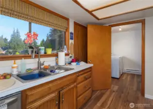 kitchen with adjacent laundry center