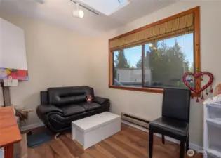 Den/office with closet and window