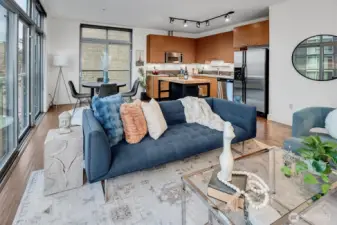 Sleek and modern living space. Open to kitchen and dining area