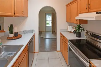 Functional galley kitchen with stainless appliances, generous cabinetry, and easy flow to the main living areas — well-maintained and move-in ready with inspection items largely completed.