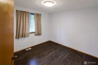 The 2nd of 3 bedrooms has a window to the backyard for privacy and a generous closet.