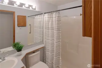 Clean and functional full bath with tub/shower combo and ample vanity space — well cared for and ready for its next owner.