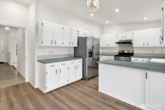 Bright kitchen with all new stainless appliances.