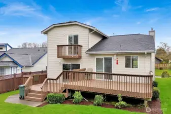 Backyard has beautiful landscaping and low maintenance. Large deck to enjoy Birch Bay views. Lower deck would be a great spot for a jacuzzi.