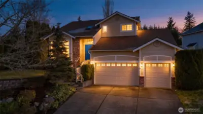 Superbly landscaped front yard provides a welcoming feel for this home