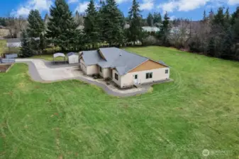 One large carport, two shed next to driveway