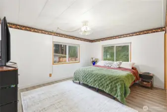 Spacious primary bedroom with natural light